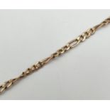 A 7.5 inch Figaro chain bracelet with lobster claw clasp. Gold marks to fixings and clasp. Total