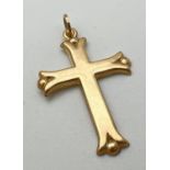 A 9ct gold cross shaped pendant with ball detail to each point. Bale marked 375. Approx. 3.5cm x
