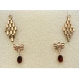 2 pairs of gold drop style earrings. A pair of chain link diamond shaped drops together with a