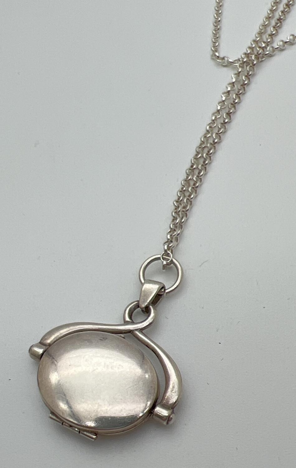 A boxed silver oval shaped spinning locket on an 18" belcher chain with spring ring clasp. Pendant - Image 4 of 4