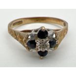 A vintage 9ct gold sapphire and diamond dress ring. A small central round cut diamond surrounded