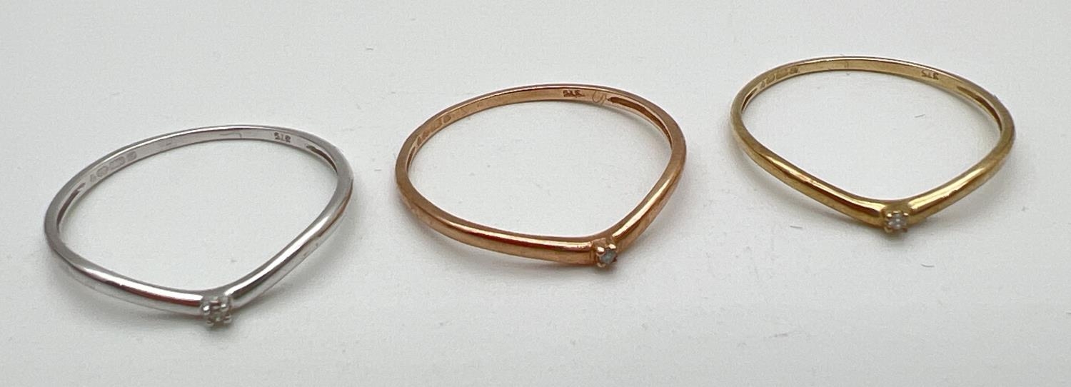 A boxed 9ct gold "Celtic Dreams" triple stacking ring set. 3 wishbone style rings each set with a - Image 4 of 4