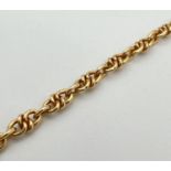 A 9ct gold 8" knot link bracelet with lobster claw clasp. Gold marks to both fixings and clasp.