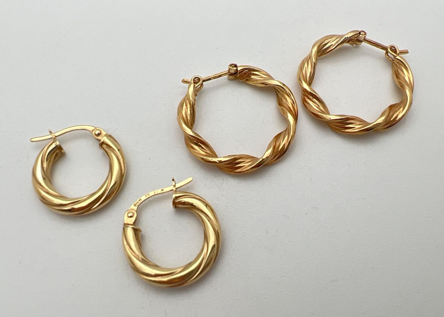 2 pairs of 9ct gold twist design hoop earrings. Gold marks to posts. Largest approx. 2.25cm