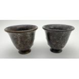 A pair of small Chinese bronze footed incense pots with embossed detail to outer bowl. Impressed