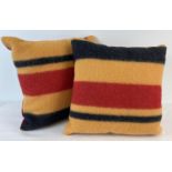 A pair of Newmarket Blanket cushions in gold, red and black. Horse blanket fronts with soft fine