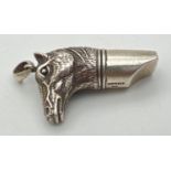 A silver whistle in the shape of a horses head, with pendant bale. Marked 925 Sterling. Approx.