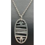 A Scottish silver contemporary oval pendant with pierced work design, on a 24" belcher chain with