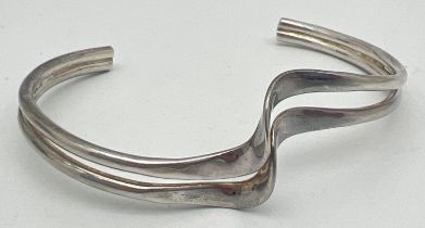 A silver modern design double wave style cuff bangle. Silver marks to inside. Total weight approx.