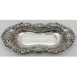 An Edwardian silver pin dish/card tray with decorative floral & scroll design rim with pierced
