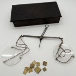 A vintage wooden boxed set of glass dish opium scales with various square small brass weights