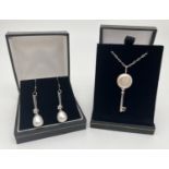 A 925 silver key shaped pendant set with 13mm pearl, on a 17" chain, together with a pair of