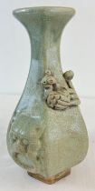 A Chinese jade glazed hexagonal shaped vase with crackle glaze and applied peacock bird detail.