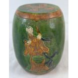A Chinese ceramic miniature garden stool with green & brown glaze and figural detail. Approx. 16cm