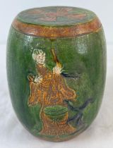 A Chinese ceramic miniature garden stool with green & brown glaze and figural detail. Approx. 16cm