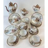 A vintage Japanese egg shell tea set with a design of oriental ladies playing musical instruments by