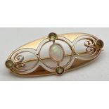 A Merrle Bennet Art Nouveau 15ct gold brooch set with central oval cut opal and 4 small round cut