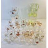 A box of assorted mid century glass ware to include transfer printed glasses and gilt striped
