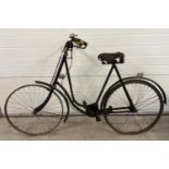 An early 20th century Imperial Rover of Coventry bicycle with leather Middlemore sprung saddle seat.