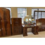 A vintage 1940's walnut veneer 4 piece bedroom suite with shaped handles of channelled design. 2