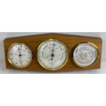 A vintage wooden mounted, wall hanging British Rototherm triple barometer. With gauge for