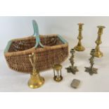 A small collection of assorted vintage brass items, in a 1940's shopping basket. Brass ware to