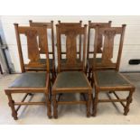 A set of 6 Art Nouveau dark oak dining chairs with turned legs and stylised carved backs. Turned