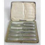 A boxed set of silver handled butter knives with laurel wreath decoration. Hallmark and registered