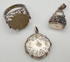 3 vintage silver items. A locket with engraved foliate design to front, stamped silver to reverse; a