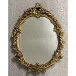 A vintage wall hanging hall mirror with gold painted chalk frame of scroll & foliate design. Approx.