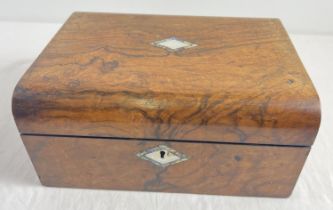 An antique wooden writing box (interior slope and compartments missing) with brass lock and