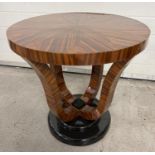 An Art Deco design circular shaped dark wood veneer occasional table with polished finish and