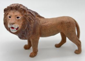 After Franz Bergmann - a small cold painted bronze figurine of a lion. Approx. 6cm tall x 10cm long.