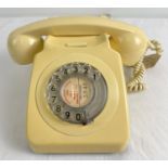 A vintage cream coloured GPO 746 rotary telephone with original tag to handset lead.