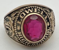 A vintage 1970 10ct gold American Lowell High School signet ring set with an oval red stone -