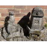 2 vintage concrete garden ornaments - a windmill together with otters. Tallest approx. 46cm tall.