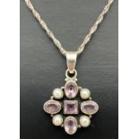 A modern design silver pendant set with round and square cut Rose De France amethysts and white