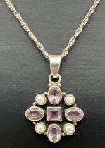 A modern design silver pendant set with round and square cut Rose De France amethysts and white