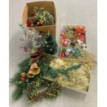 A collection of assorted vintage Christmas decorations to include table top trees, plastic