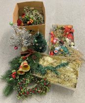 A collection of assorted vintage Christmas decorations to include table top trees, plastic