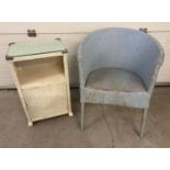 A vintage Lloyd Loom style basket chair by Spinney painted pale blue together with a white painted