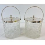A pair of cut glass and silver plated biscuit barrels with swing handles. Each approx. 12.5cm