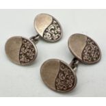 A pair of late Victorian Charles Horner silver cufflinks with half engraved oval panels of