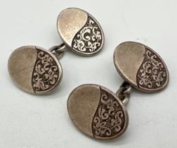 A pair of late Victorian Charles Horner silver cufflinks with half engraved oval panels of