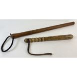 2 vintage wooden truncheons. A traditional police style truncheon with ribbed handle and leather