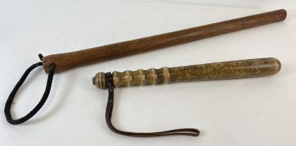 2 vintage wooden truncheons. A traditional police style truncheon with ribbed handle and leather