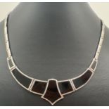 A silver and black onyx Art Deco style fixed pendant flat link necklace, with clip clasp. Approx. 16