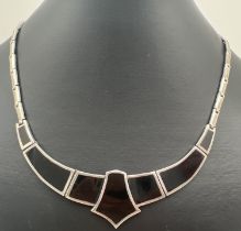 A silver and black onyx Art Deco style fixed pendant flat link necklace, with clip clasp. Approx. 16