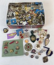 A collection of vintage metal and enamel pin and lapel badges. To include Quilter Guild, Royal