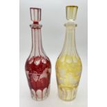 2 late Victorian bohemian glass decanters with etched grape & vine detail. With cranberry and